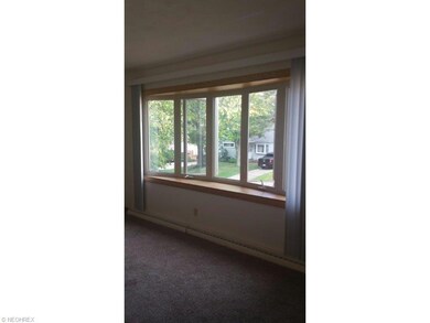 Large bay window in living room.