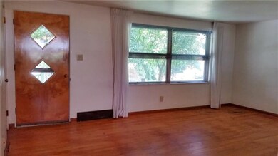 Living room with hardwood floors. Plenty of natura