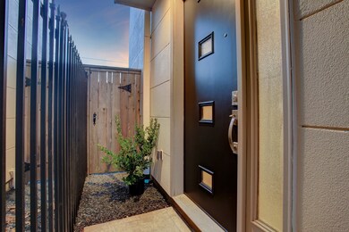 Walk thru iron gated entry to front door.