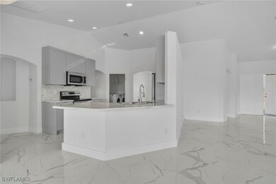 Kitchen with appliances with stainless steel finis