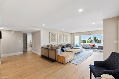 Living area featuring light wood-style floors, recessed lighting, and baseboards