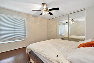 Master Bedroom with Laminate Floors and Ceiling Fan