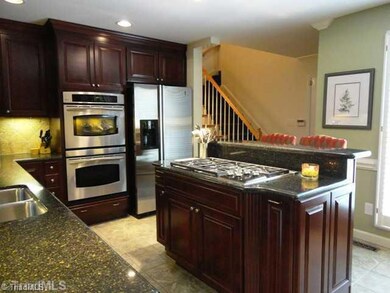Kitchen. This kitchen has it all - SS appliances, Wolf 5-burner gas range, wine fridge, double ovens