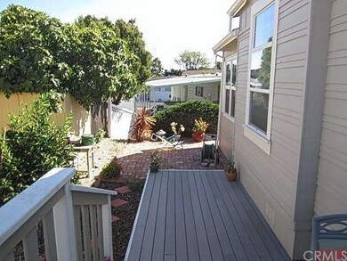 Beautiful custom deck leading to a nice brick pati
