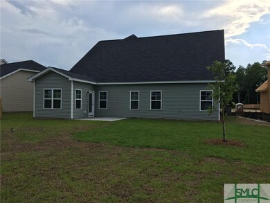 Large back yard with patio.