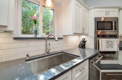 Light and bright kitchen with updated bright, whit