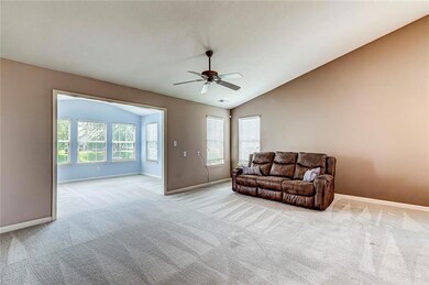 Great room and a peek into the sun room.