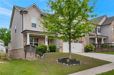 Craftsman-style home with driveway, a front yard, 