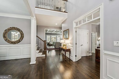 Spacious foyer with beautiful millwork and sightlines into the main living areas for a grand first impression.