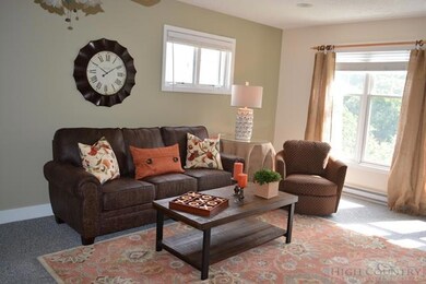 Nicely furnished Living Room: Nice big windows fac