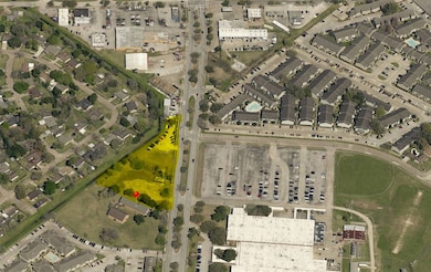 Property is highlighted in yellow, land only. adja