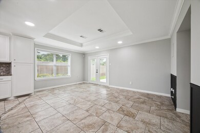 Bright, open living space with large tile flooring