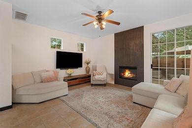 Living area featuring a large fireplace, healthy 