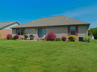 Landscaped patio overlooking the backyard with...