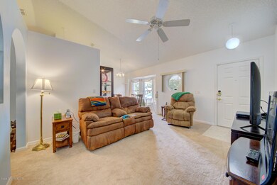 living room with vaulted ceiling