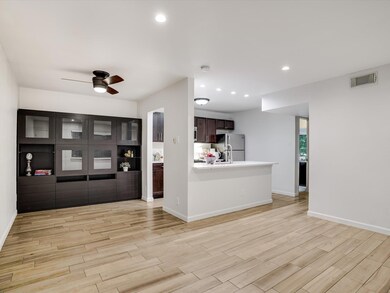Unfurnished living room with a ceiling fan, reces
