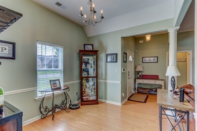 Host the finest dinner parties in the romantic dining room embellished with a dazzling chandelier, gleaming hardwood floors, soaring ceiling, and a chair rail.