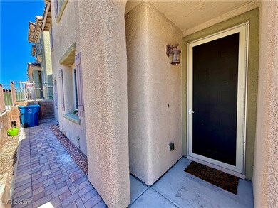 View of exterior entry with stucco siding