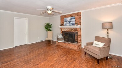 One side of the family room with wood floor and wo