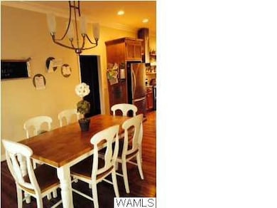 Spacious Dining room has hardwood floors