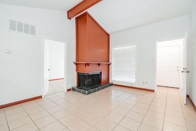 Unfurnished living room with vaulted ceiling with 