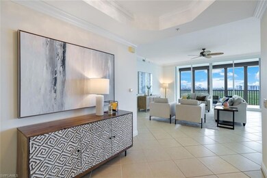 Living room with ornamental molding, ceiling fan, 