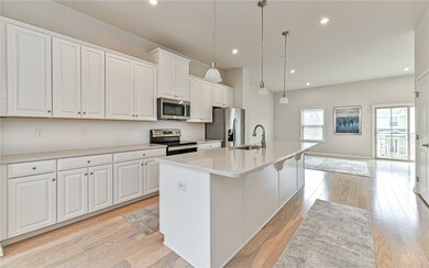 Sleek white kitchen with stainless steel appliance