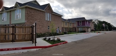 View of concrete street with curbs, a residential view, and sidewalks