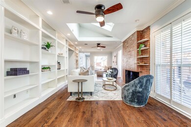 Living room features a ceiling fan, wood floors, v