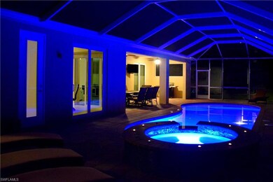 View of pool featuring glass enclosure, an in grou