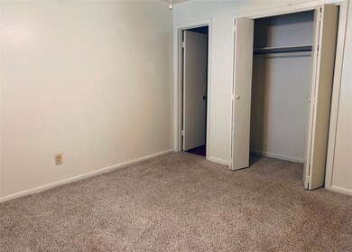 Unfurnished bedroom featuring carpet flooring, a c