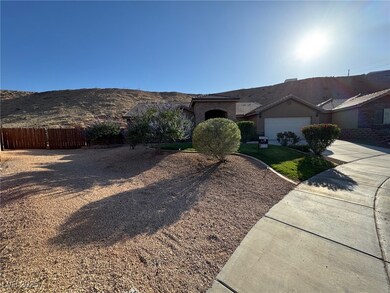 Ranch-style home with driveway, an attached garage
