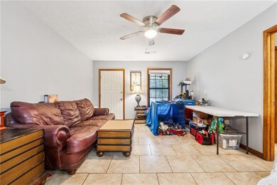 807 Charleston - Tiled living room featuring ceiling fan