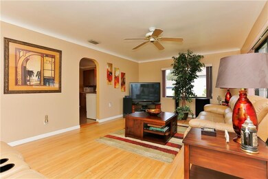 Living Room with Arched Entrance to Kitchen