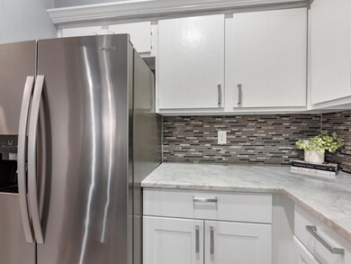 Stainless steel refrigerator included.