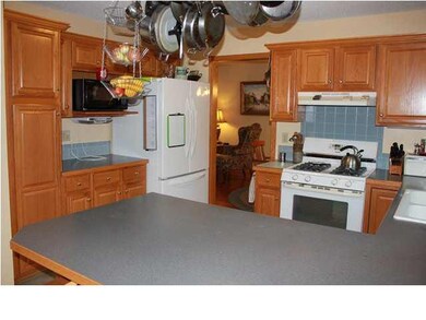 Kitchen with gas range and eating bar.