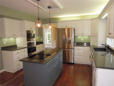 Bright kitchen with quartz countertops, new paint,