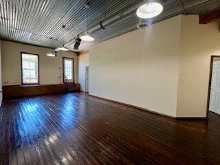 Loft living room, original hardwood floors, door t