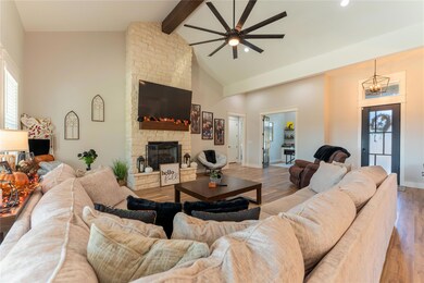 Living room with light wood-type flooring, ceiling
