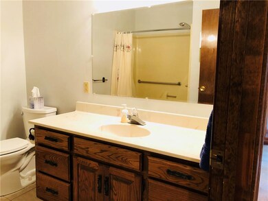 Original oak vanities with craftsman details.