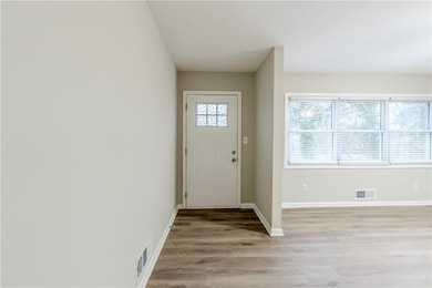 Entryway with light hardwood / wood-style flooring