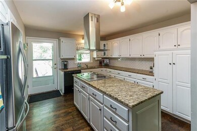 The kitchen boasts plenty of storage, and many of 