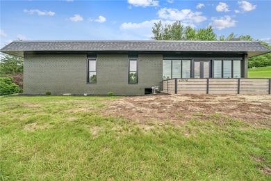 RIGHT SIDE/ FEATURE DECK AND PATIO IN FRONT