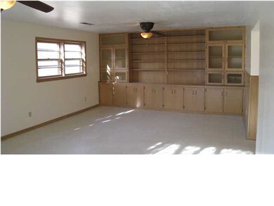 Large family room with built-ins and and walk-out
