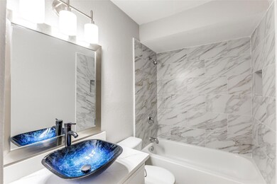 Full bathroom featuring vanity, bathtub / shower 