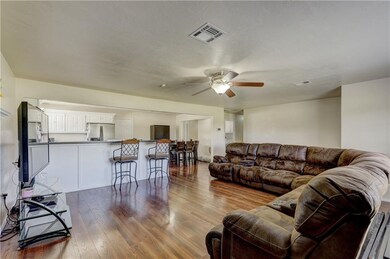 View of Living Room and Open Bar in Kitchen