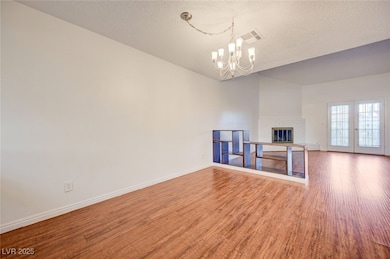 Unfurnished living room with wood finished floors,