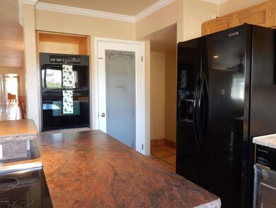 Granite counters and view of pantry