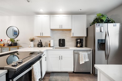 Kitchen featuring stainless steel appliances, dec