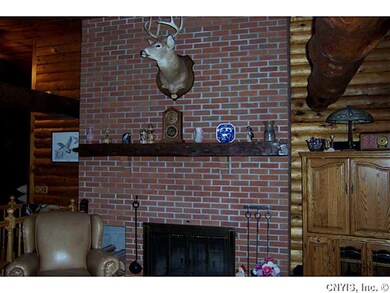 Great Room. Ceiling to floor brick fireplace.